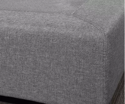 Détail tissu du sommier tapissier gris